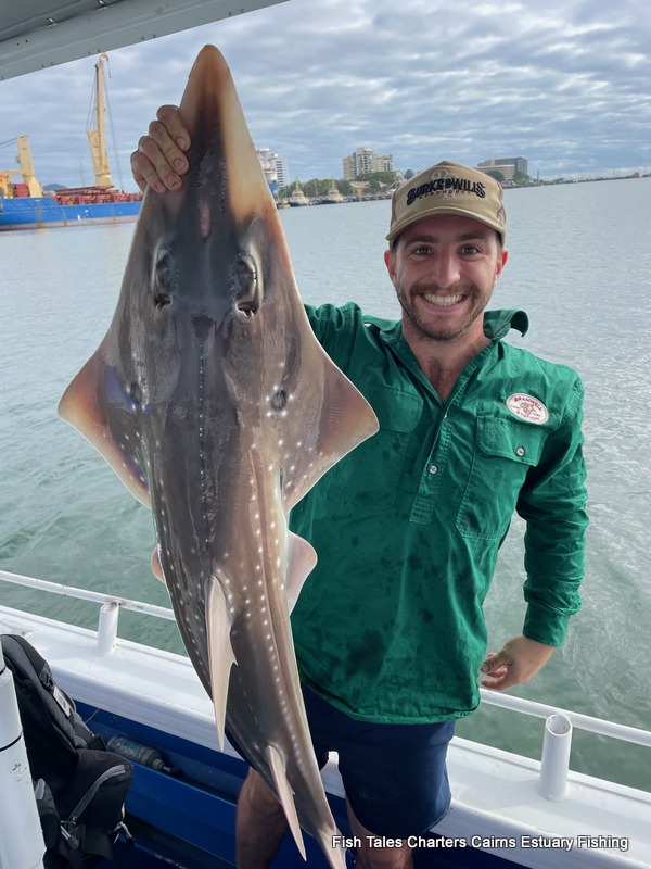 Ollie and his False Trevally while taking a guided estuary fishing charter from Cairns