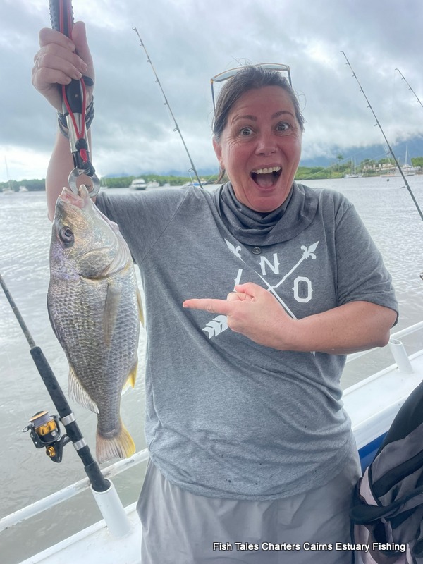 Liz is so happy to show us her caught of a Barred Javelinfish (locally known as a Grunter) while estuary fishing in Trinity Inlet, Cairns!