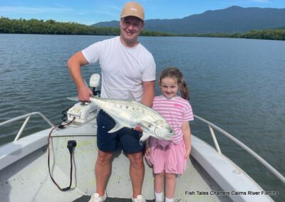 Cameron and his daughter showing us their catch of a Giant Queenfish while popper fishing on the Mulgrave & Russell Rivers and Mutchero Inlet.