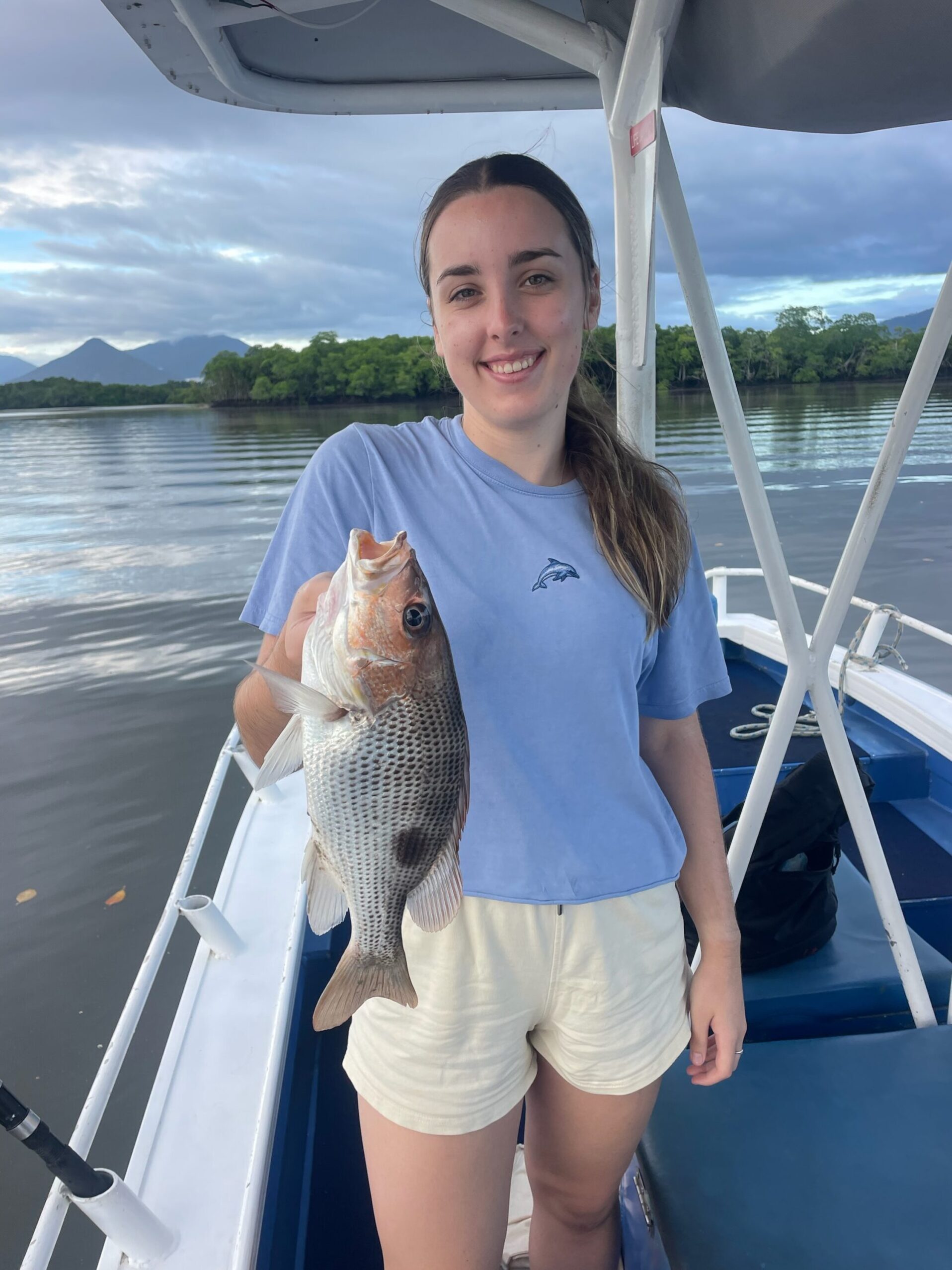 Alicia to happy to showing us her catch of a Fingermark (Golden snapper) while fishing with the family!