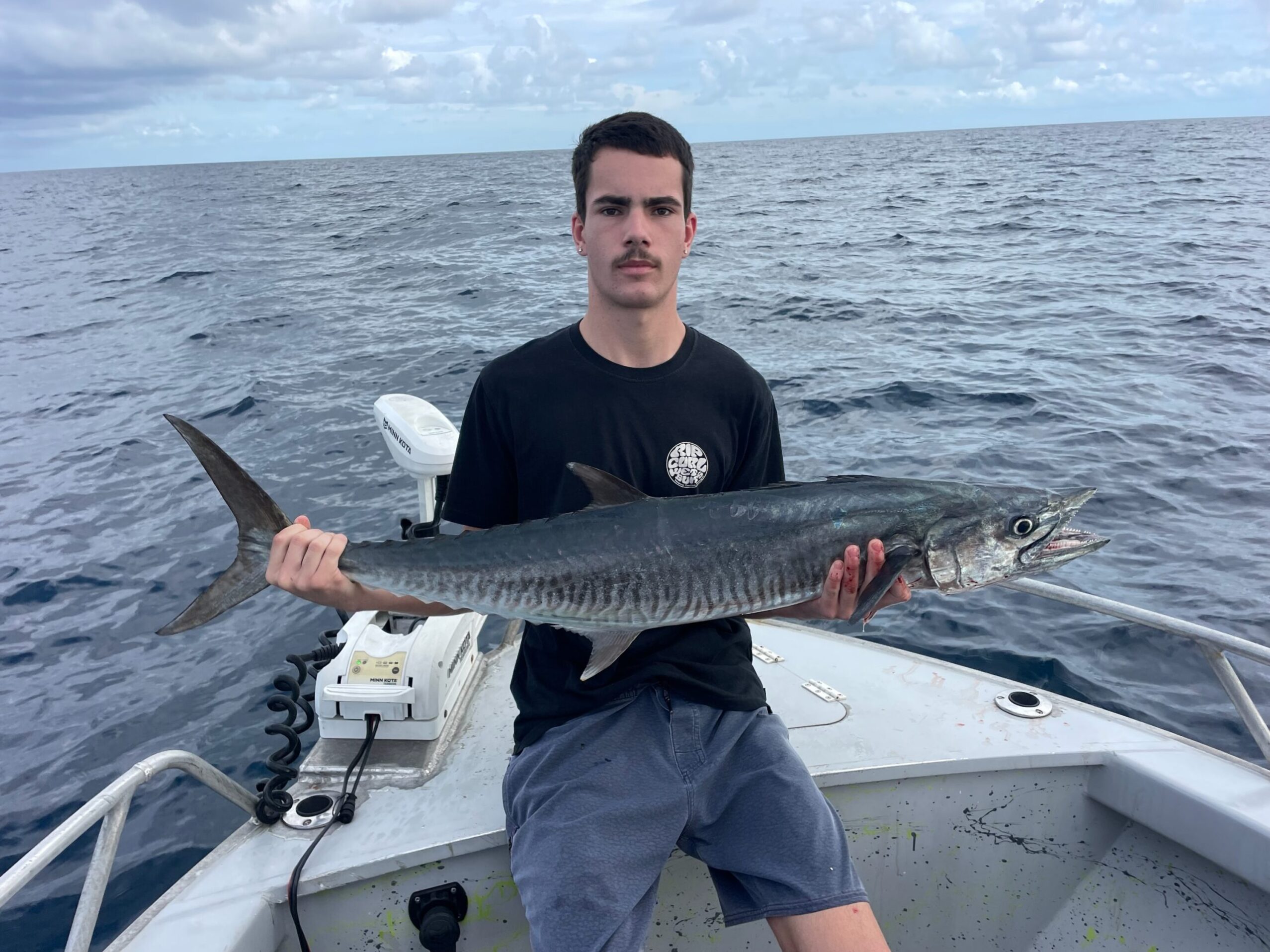 Steph proudly showing us her Spanish Mackerel while reef fishing