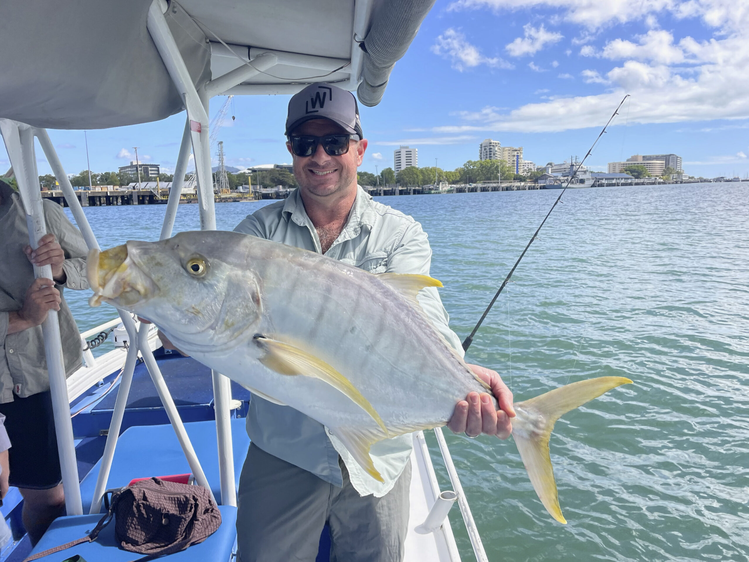 A happy customer showing us his catch of a Golden Trevally
