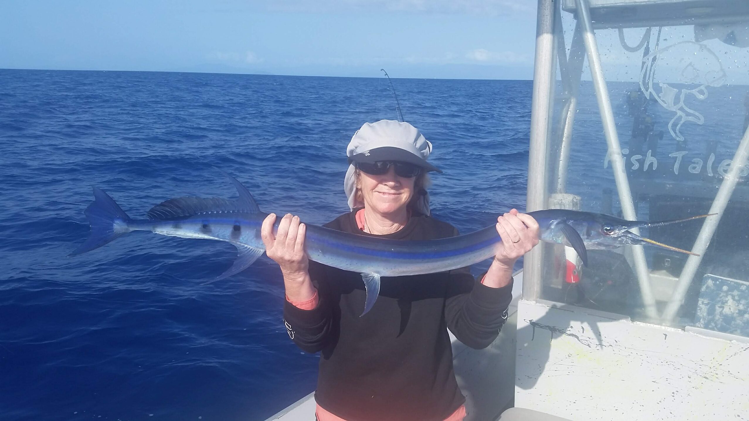 Another happy customer showing us her catch of a Stout Longtom while fishing on the Great Barrier Reef from Cairns!
